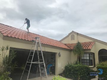 a cape coral parkway residence in the process of having their tile roof cleaned