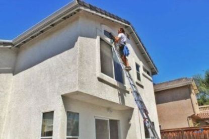 power washing upper story windows of a home in cape coral florida